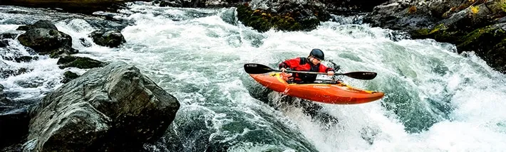 Rapid riding in whitewater kayak