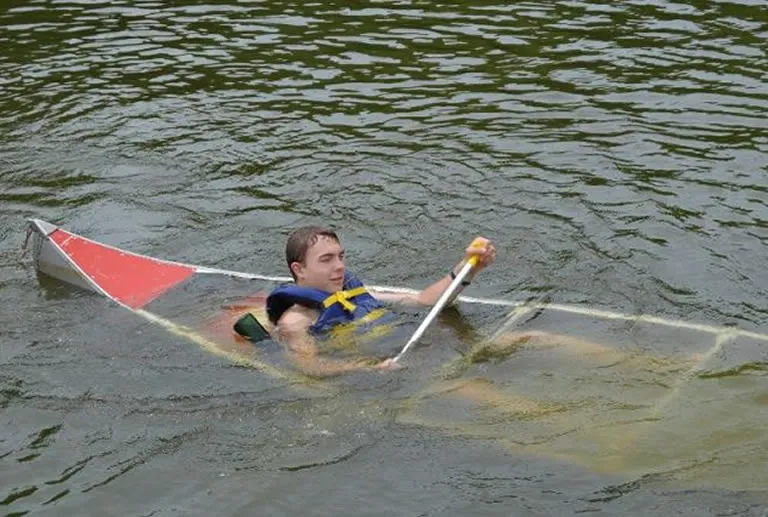 capsized canoe in river
