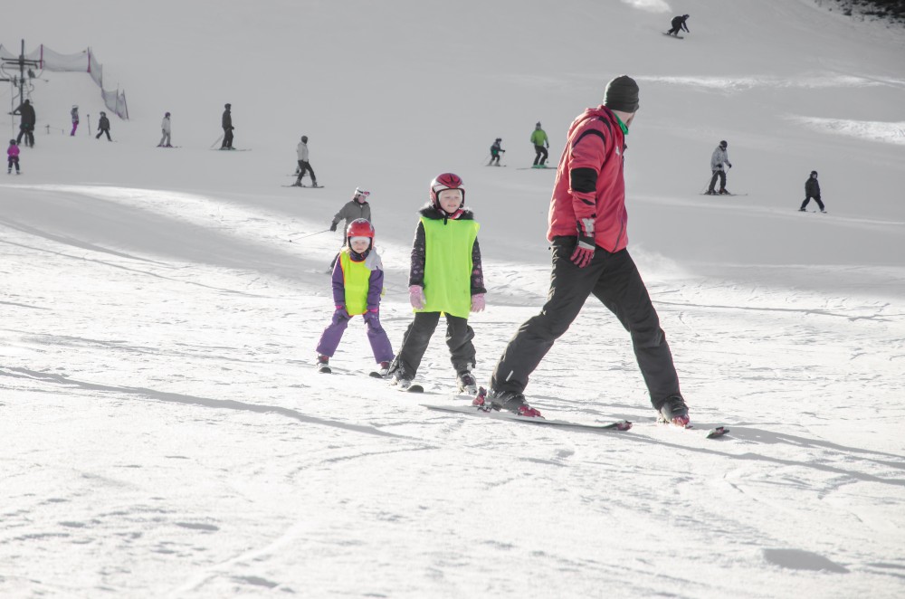 child and ski instructor